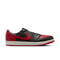 Black and red low-top sneakers with Nike swoosh and white midsole