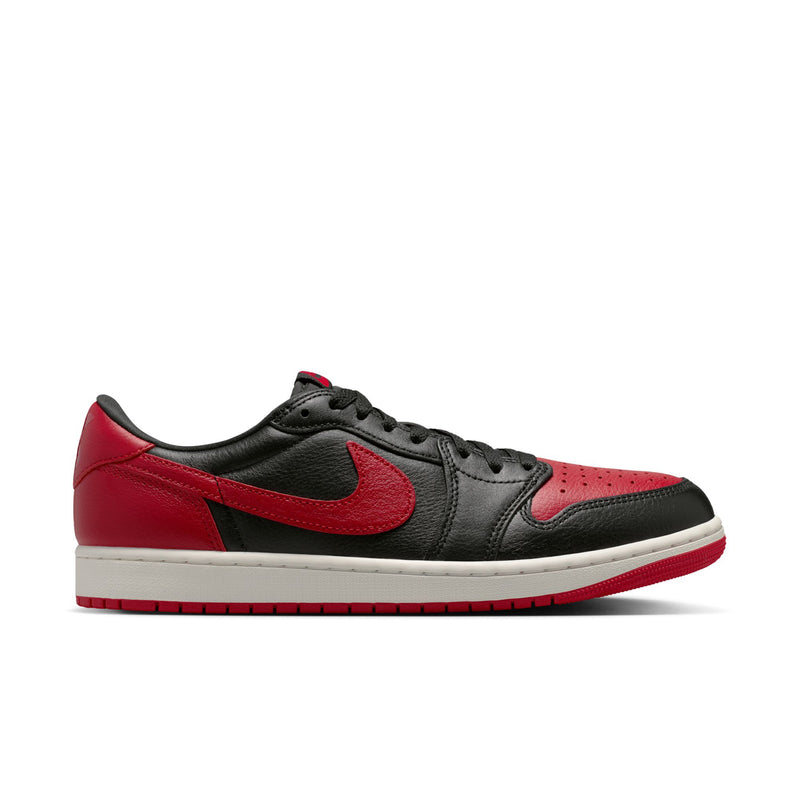 Black and red low-top sneakers with Nike swoosh and white midsole
