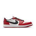 Men's low-top sneakers in red, white, and black with Nike swoosh and black laces