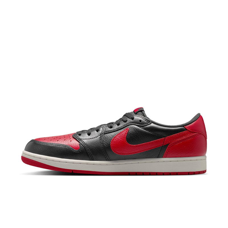 Black and red low-top sneakers with red side panels, Nike swoosh, and white midsole