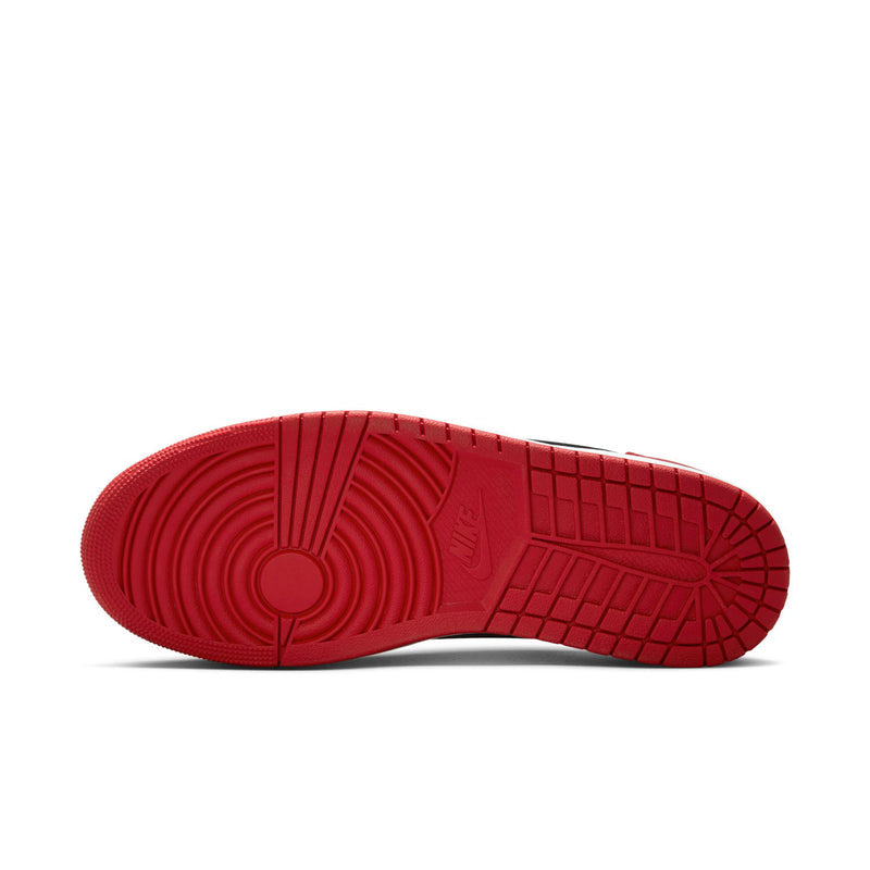 Red rubber outsole for men's low-top sneakers with textured traction pattern