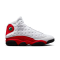White and red high-top sneakers with black sole and green eyelet detail