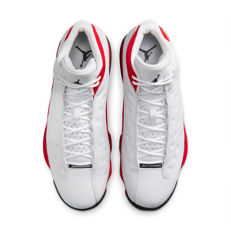 White high-top sneakers with red accents, black trim, and lace-up front view