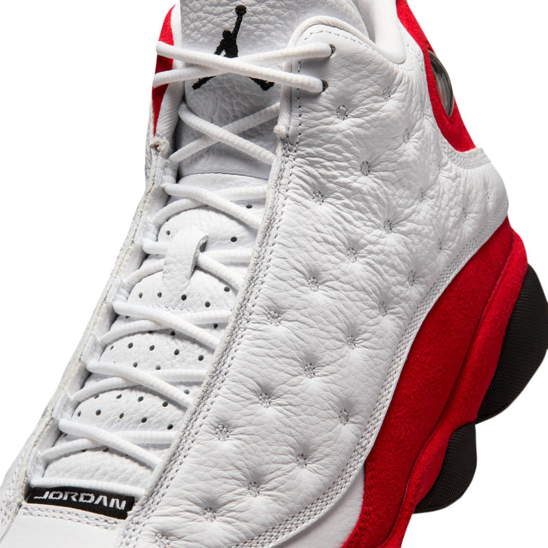 Close-up of white high-top sneaker laces with red collar and black Jumpman logo