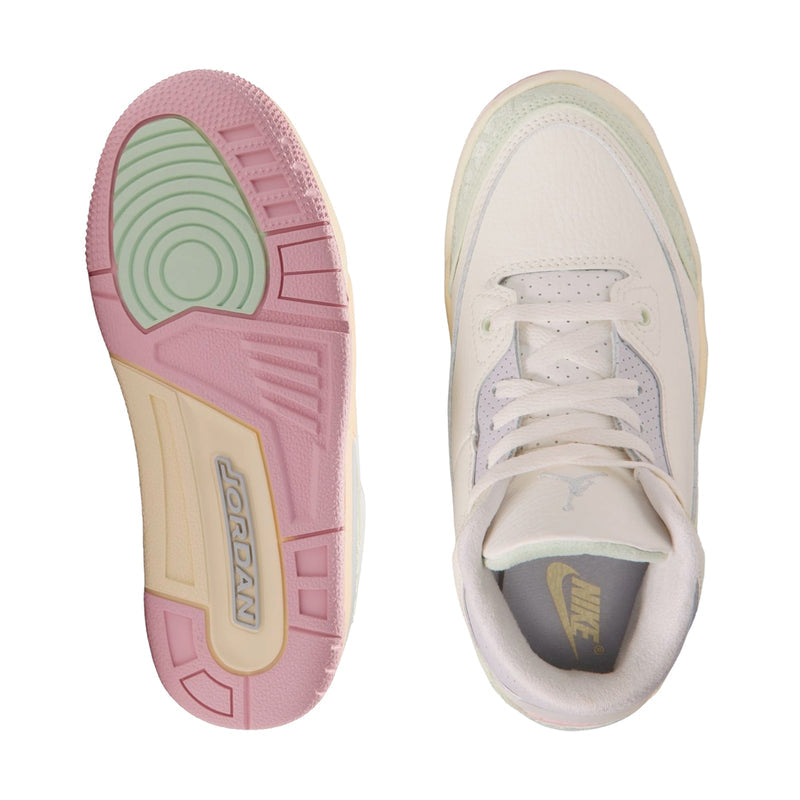 Kids' sneakers outsole and top view; white upper with laces and pink-green tread