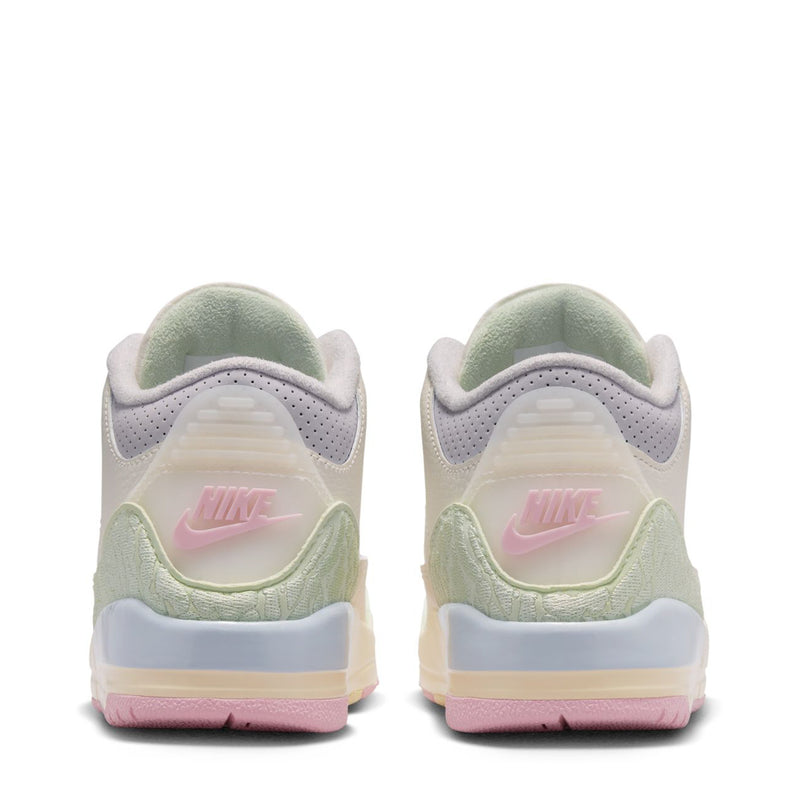 Kids' sneaker heel view in white with light green lining and pastel outsole