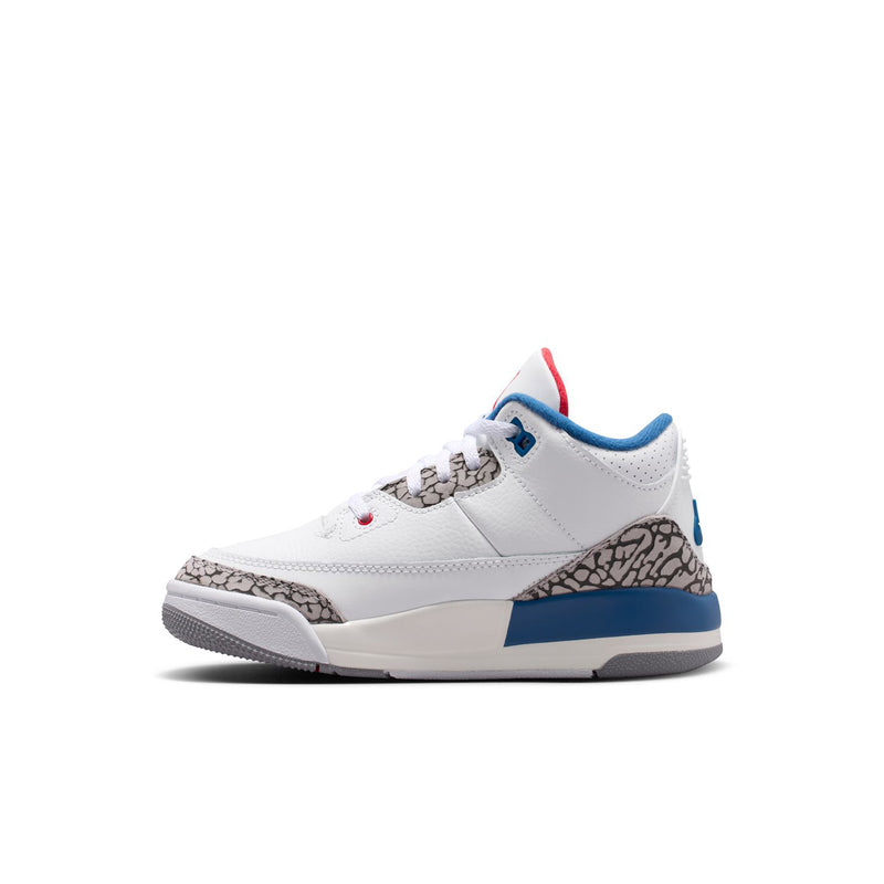 Kids white lace-up sneakers with blue heel tab and cement grey toe-corner print.
