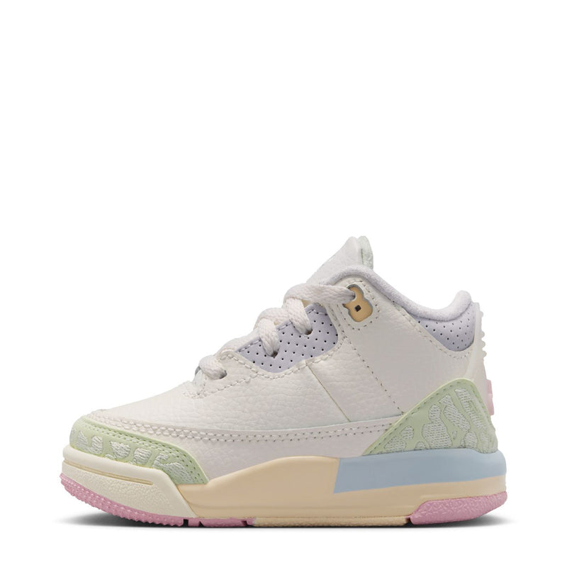 Toddler white low-top sneaker with purple-blue lace overlay and green side panel