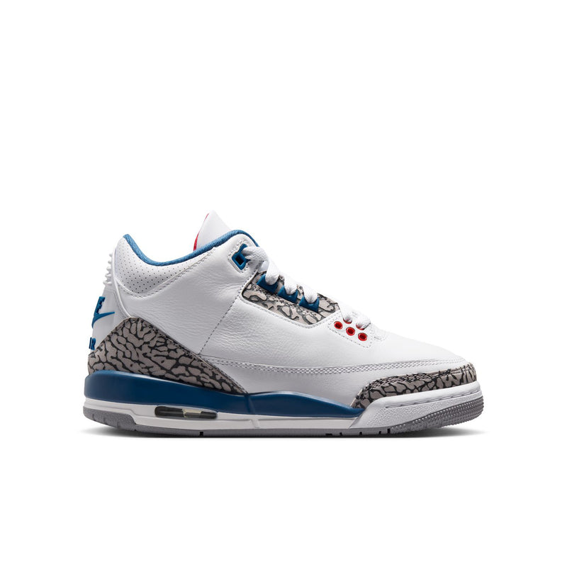 Youth white leather sneakers with blue accents, elephant-print panels, and red lace eyelets