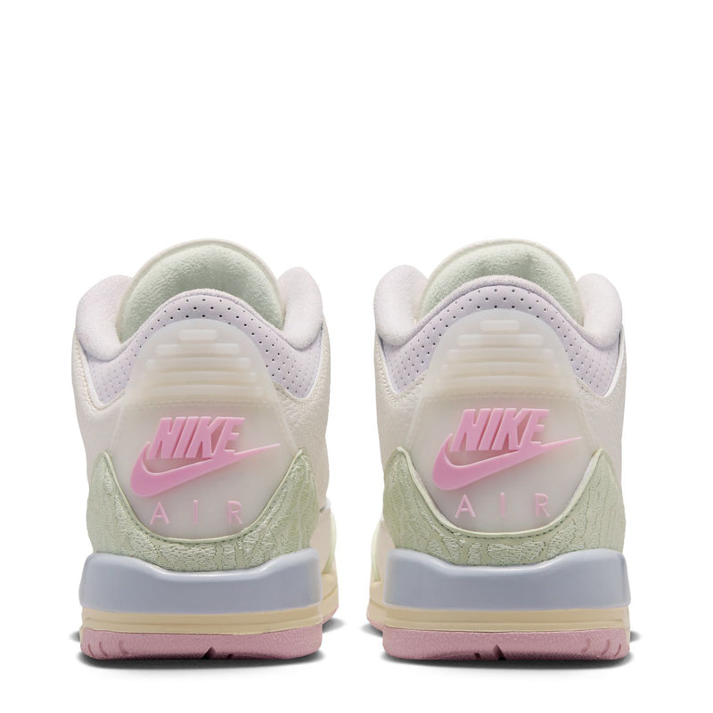 Youth sneakers heel view, white with sage green detail and Nike Air branding