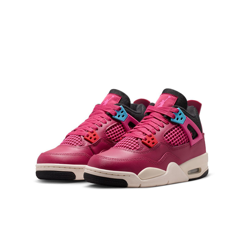 Pair of youth pink sneakers with lace-up front, black accents, and white sole