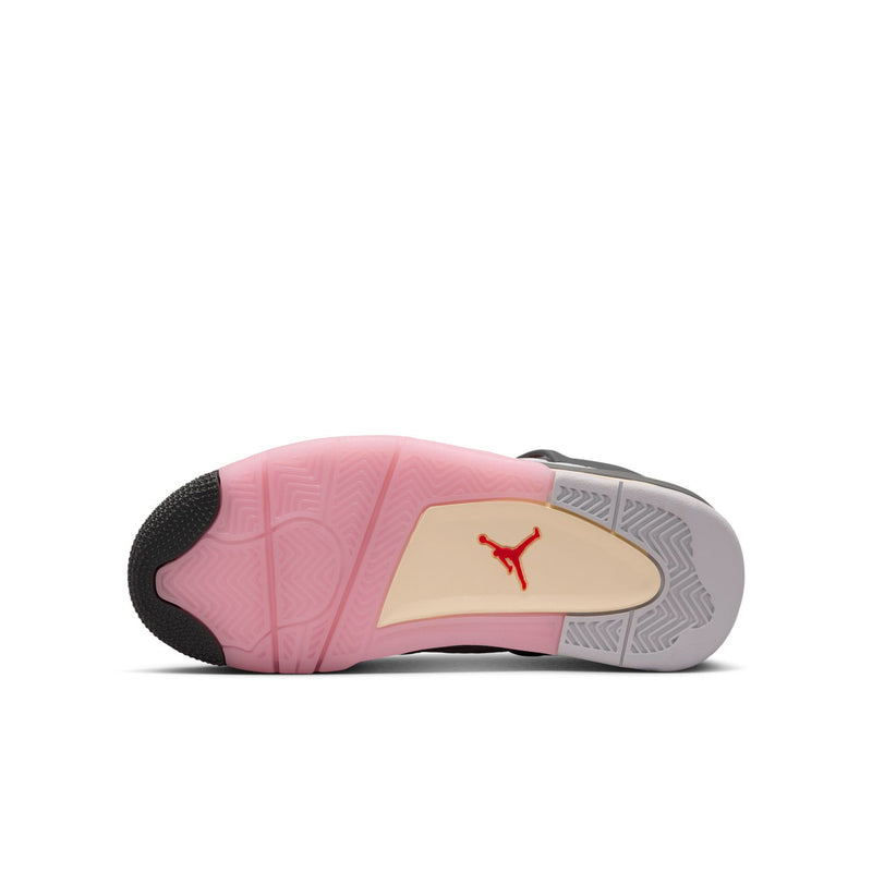 Youth sneaker outsole, pink-and-beige traction rubber with dark edge, side view