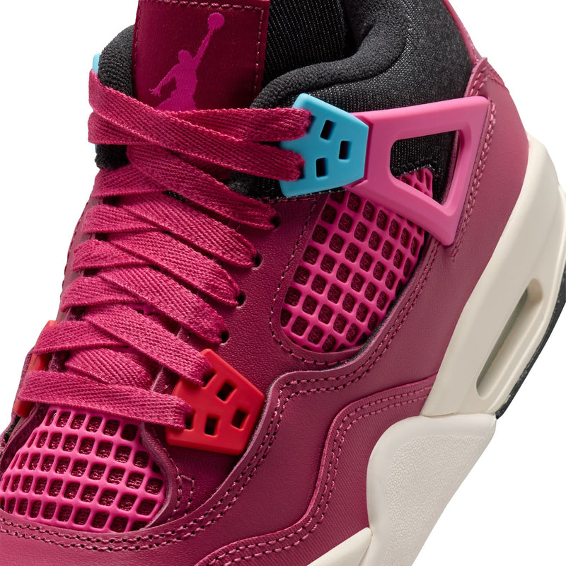 Close-up youth sneaker upper with pink laces, teal accents, and mesh side panel