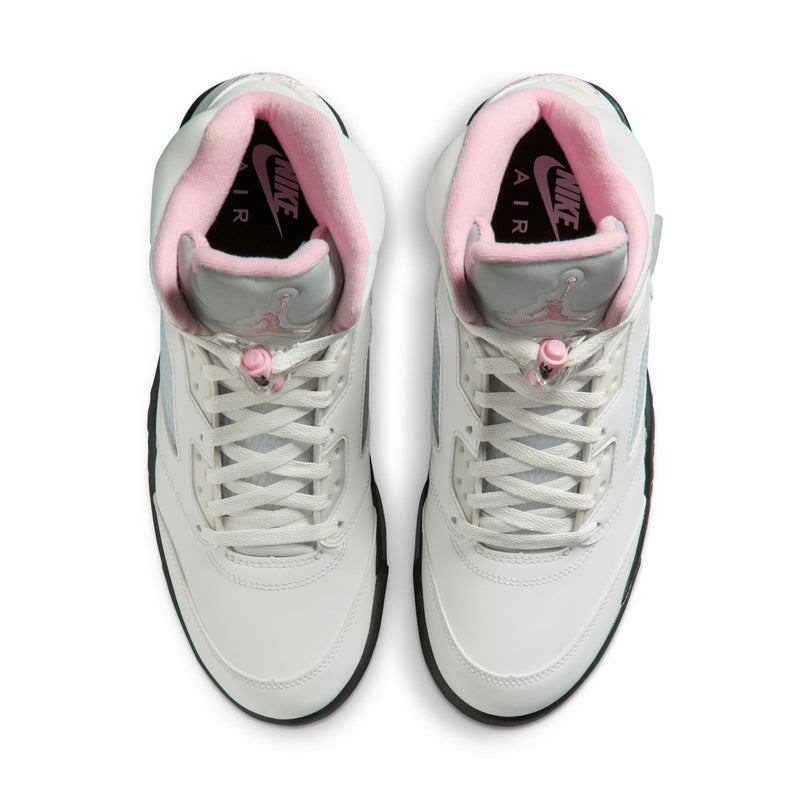 Pair of white lace-up sneakers with pink padded collars and black outsoles