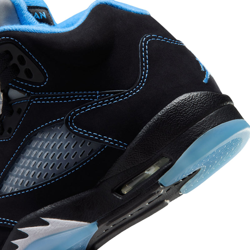 Air Jordan 5 youth side close-up, black leather with blue stitching and textured panel