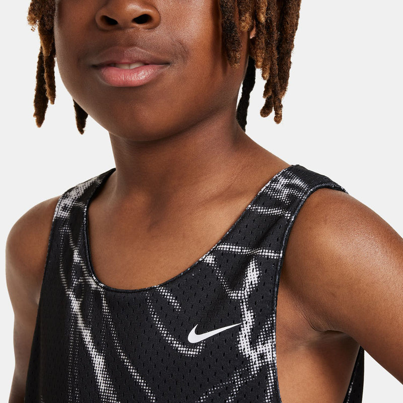 Youth reversible jersey close-up, black sleeveless with Nike swoosh and dotted mesh.