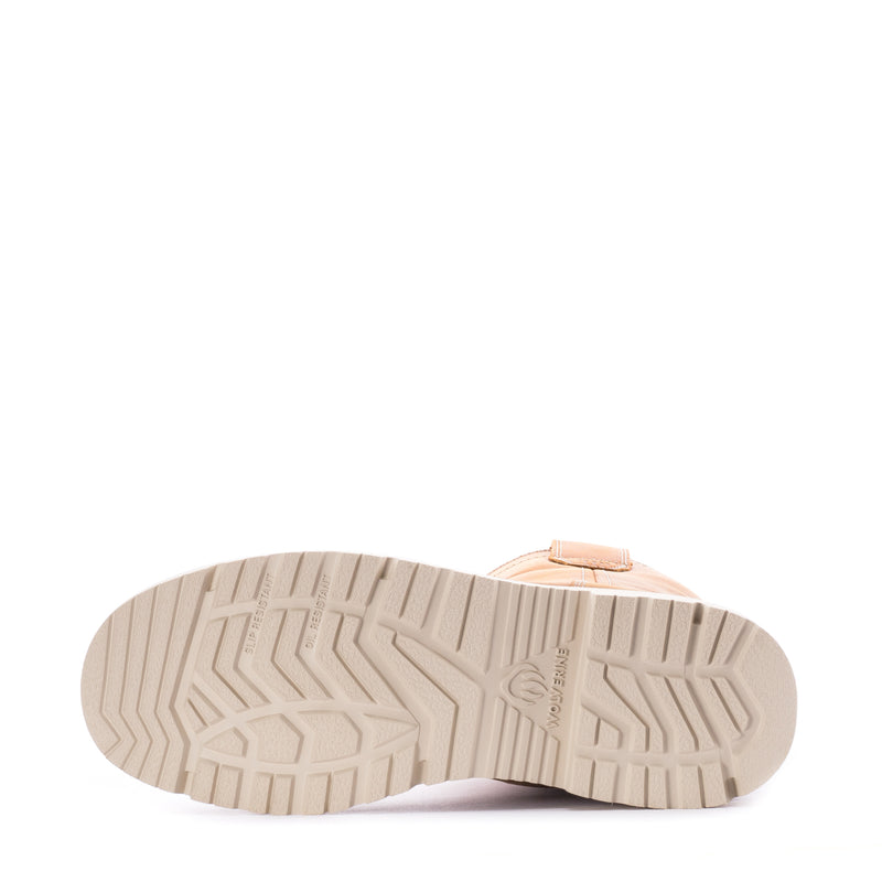 Boot outsole with deep traction tread and light-colored rubber base