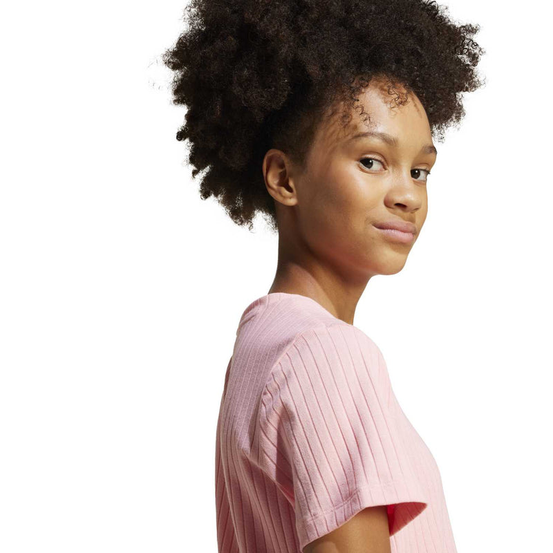 Youth ribbed knit dress close-up, semi pink short sleeves and ribbed texture