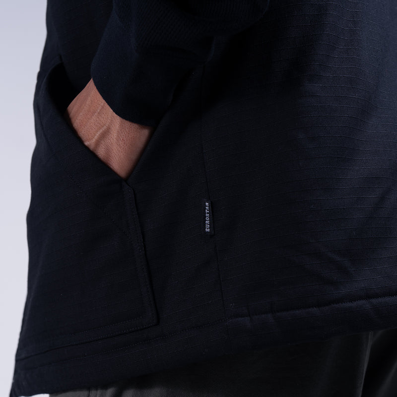 Black hooded ripstop vest with front welt pockets and small interior label
