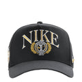 Black structured snapback cap with curved bill, front Nike crest logo