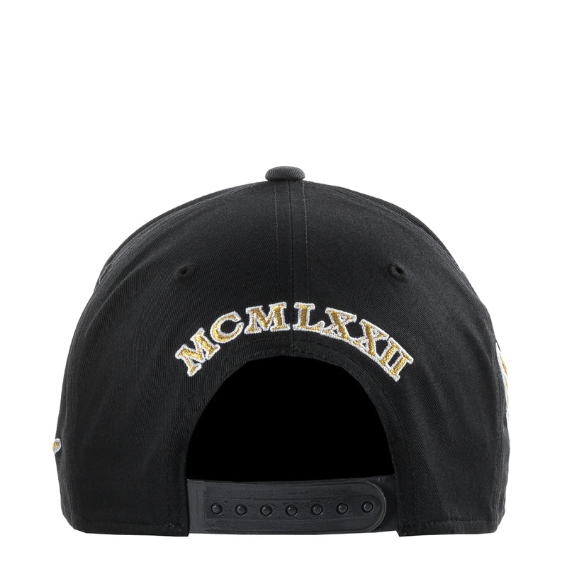 Black snapback cap back with gold lettering and snapback strap