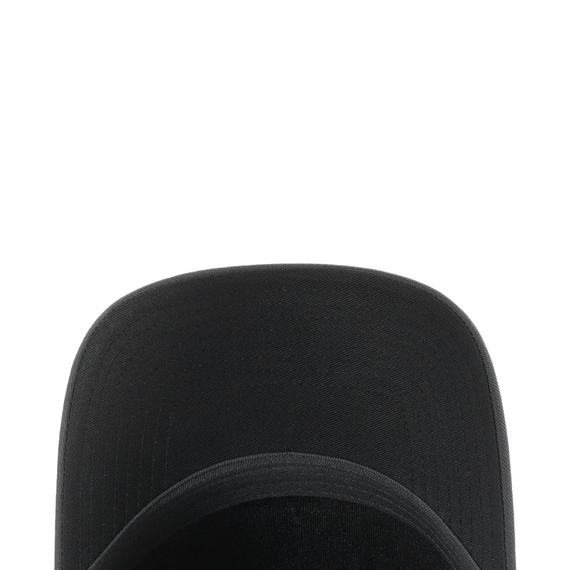 Black cap crown with textured fabric and stitched seams, curved brim edge