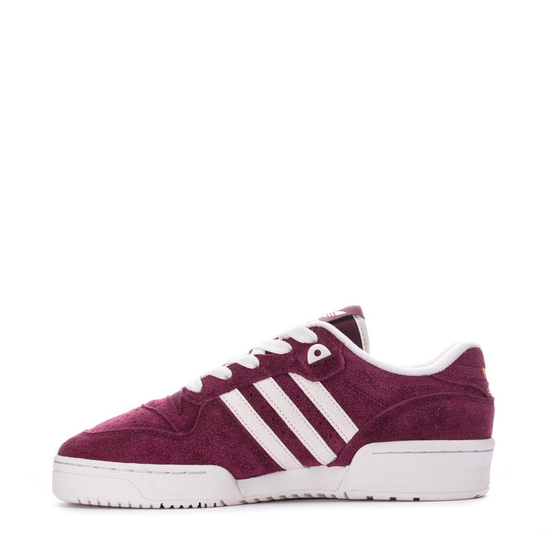 Men's burgundy low-top sneakers with white three-stripe design and rubber sole.