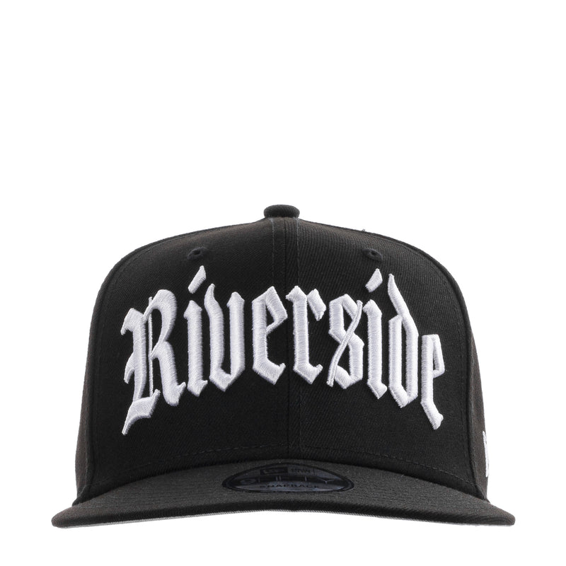 Black snapback cap with white front embroidered logo
