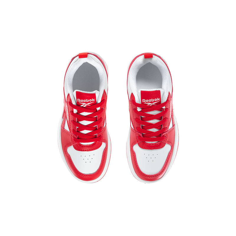 Kids red-and-white sneakers viewed from above, showing red laces and Reebok tongue
