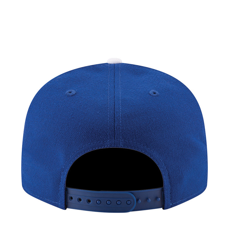 Royal blue baseball cap rear view with adjustable strap and ventilation holes