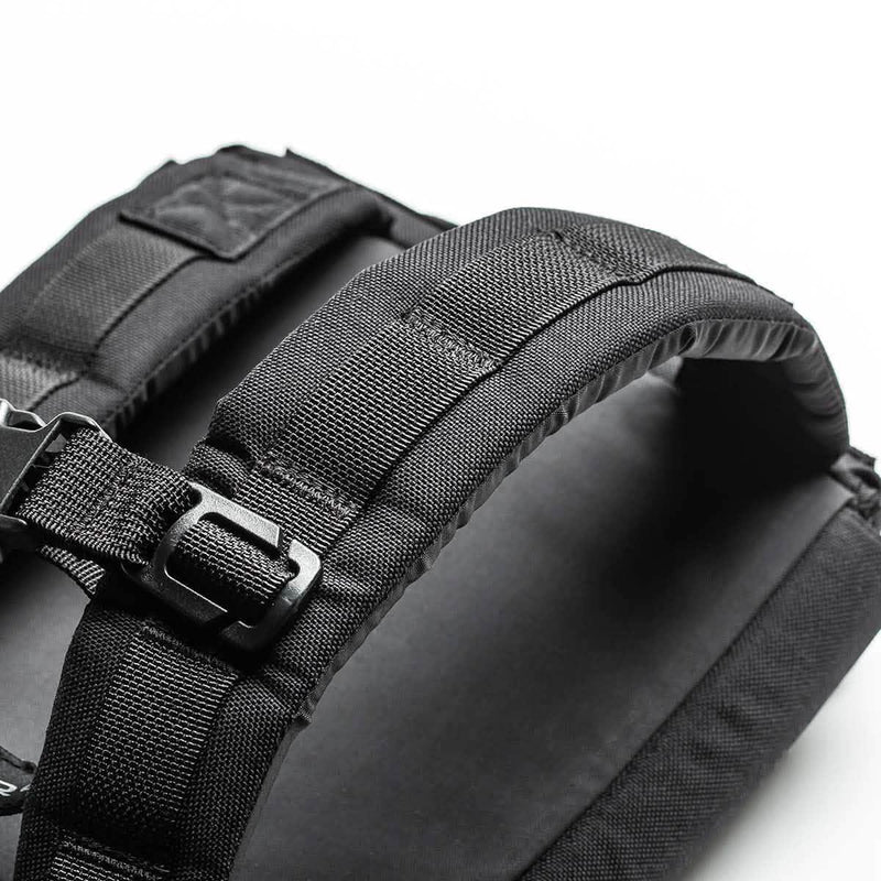 Close-up of GORUCK black rucksack shoulder straps with heavy-duty webbing and buckle