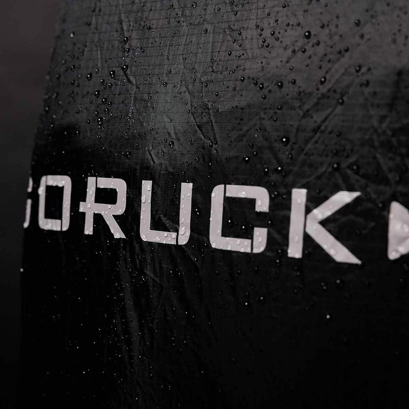 GORUCK black rucking gear with water droplets, rugged water-resistant fabric
