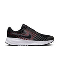 Side view of black running shoe with red/gray stripe pattern and white rubber outsole