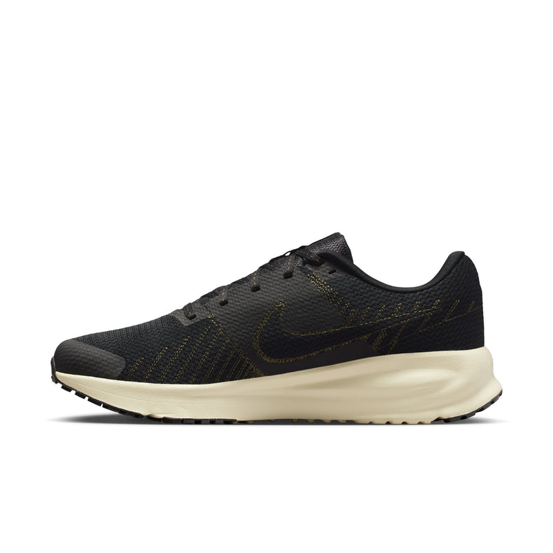 Men's Nike running shoe side view in black with cream midsole and tread