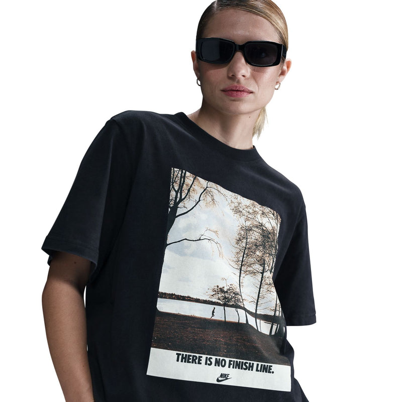 Black womens tee with large running photo graphic panel and 'THERE IS NO FINISH LINE'