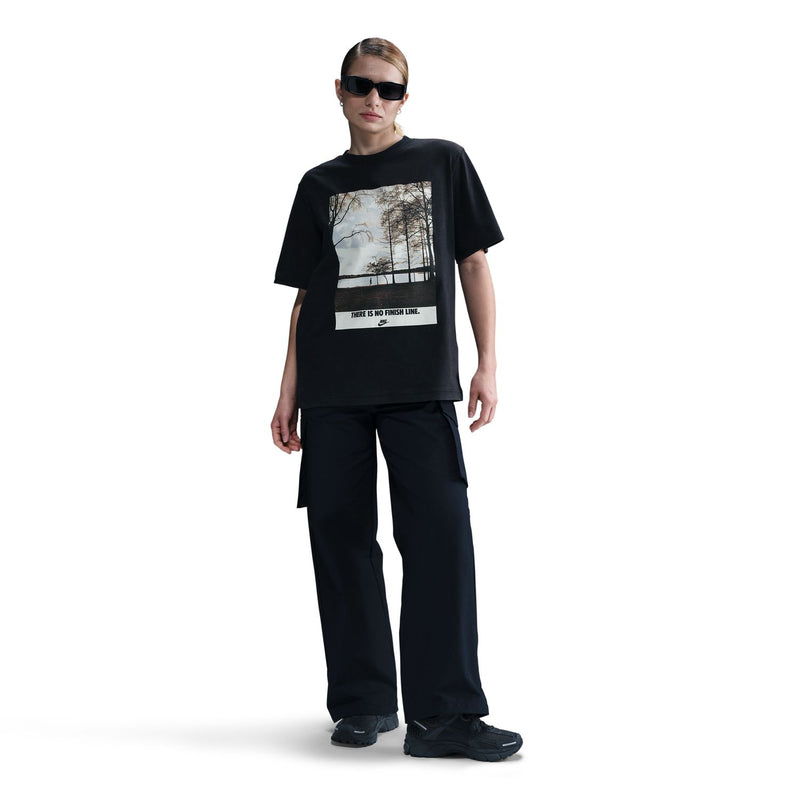 Black womens short-sleeve crewneck tee featuring running photo graphic and Nike logo