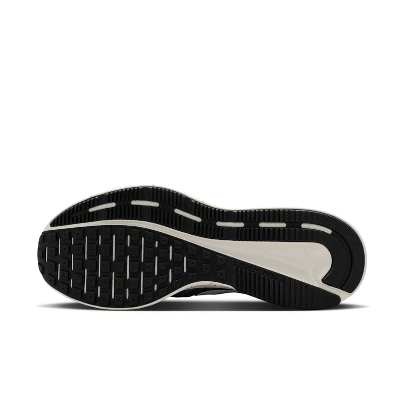 Mens running shoe outsole with black tread and off-white midsole section