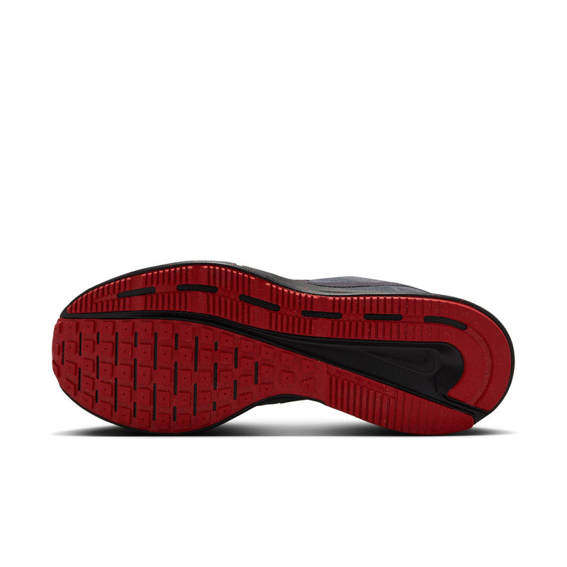 Outsole of men's dark gray running shoes with red tread and black traction lines