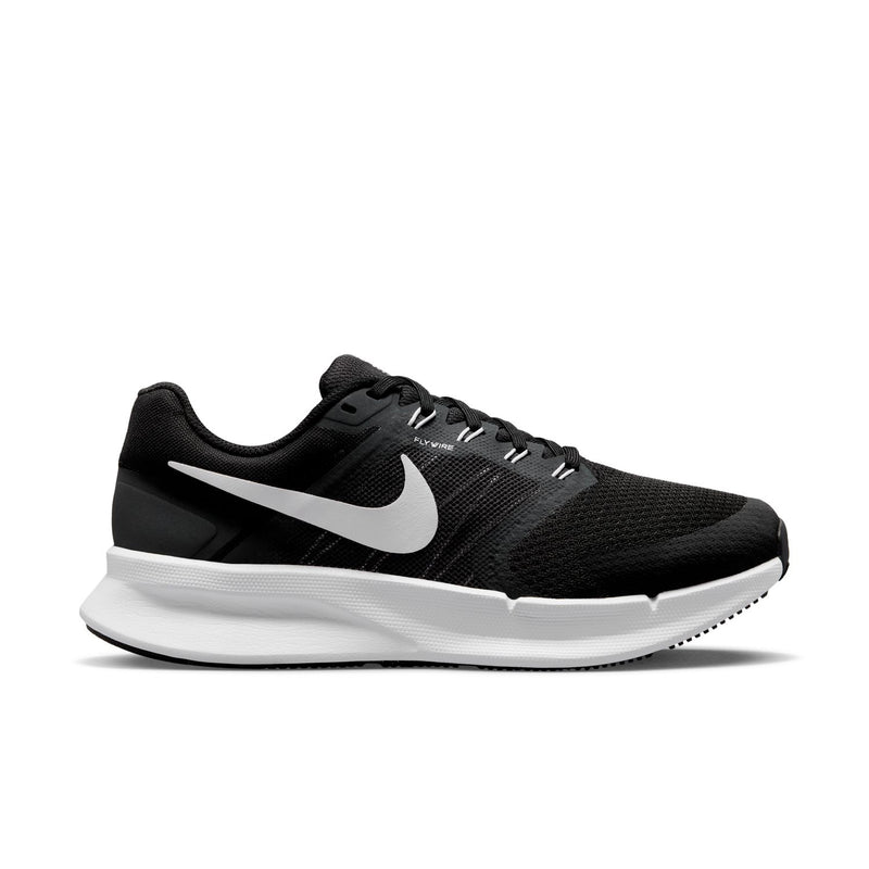 Black knit running shoe with white Nike swoosh, lace-up, and white midsole.