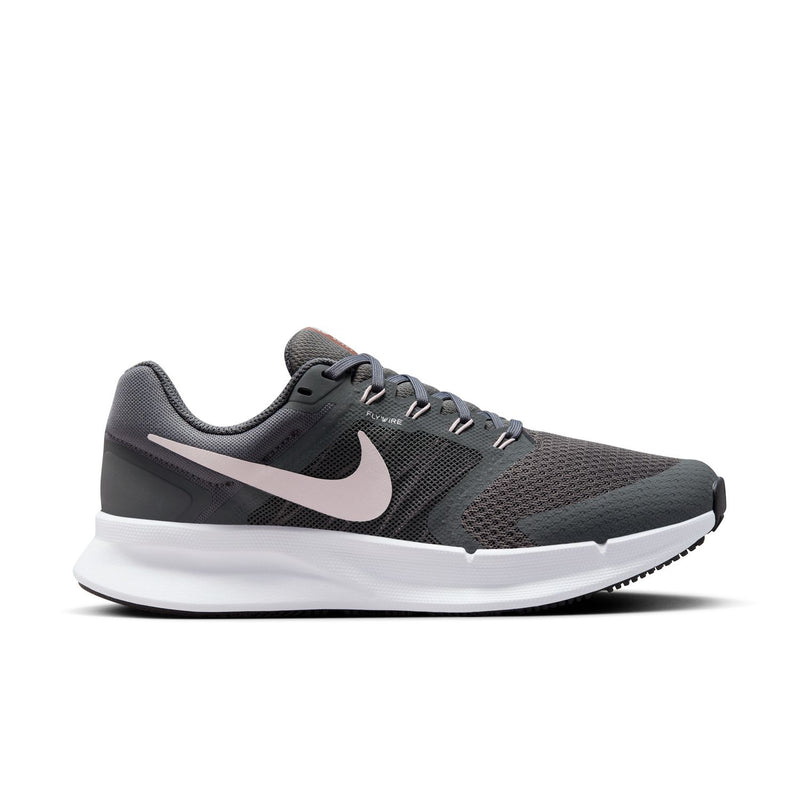 Women’s wide running shoe: dark gray mesh, pink-lilac Swoosh, white midsole