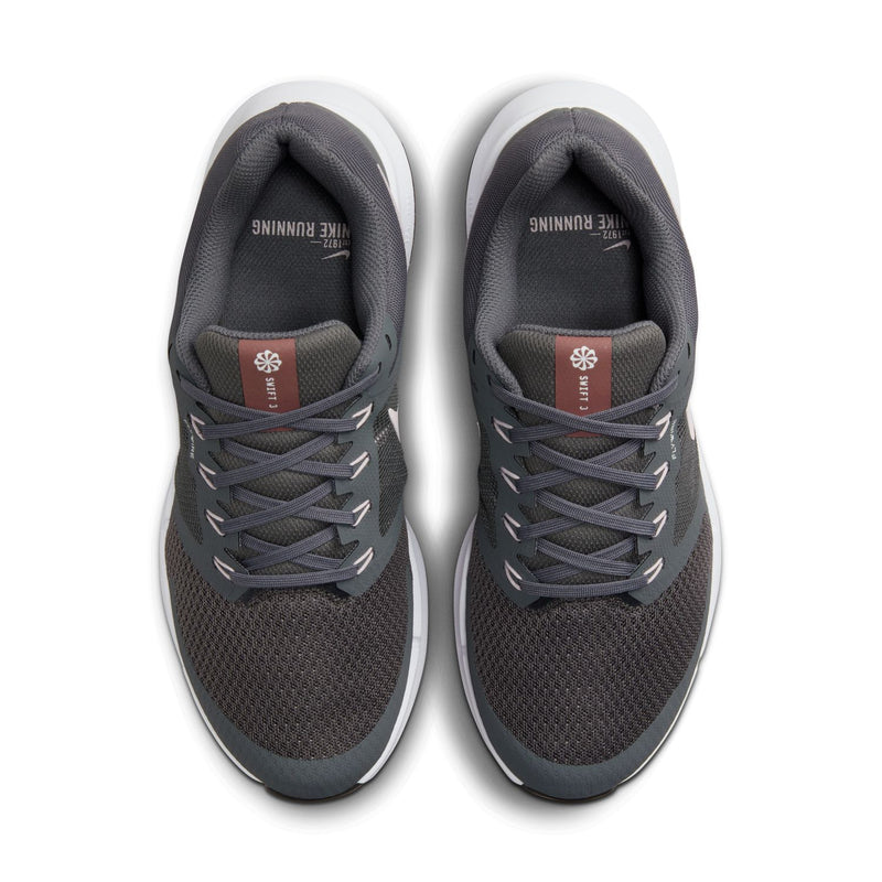Front view of dark gray running shoes with gray laces and cushioned tongues