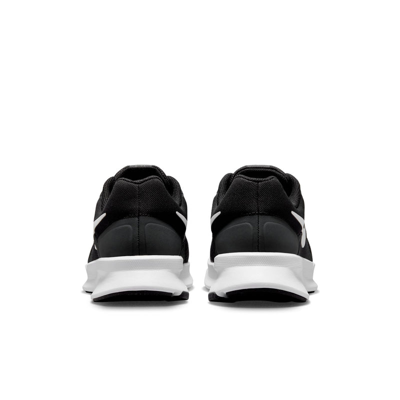 Black running shoes heel view with white midsole and cushioned back collar.