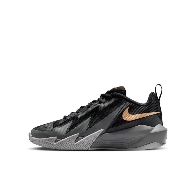 Youth basketball shoe, angled side view, black with gold swoosh and gray midsole