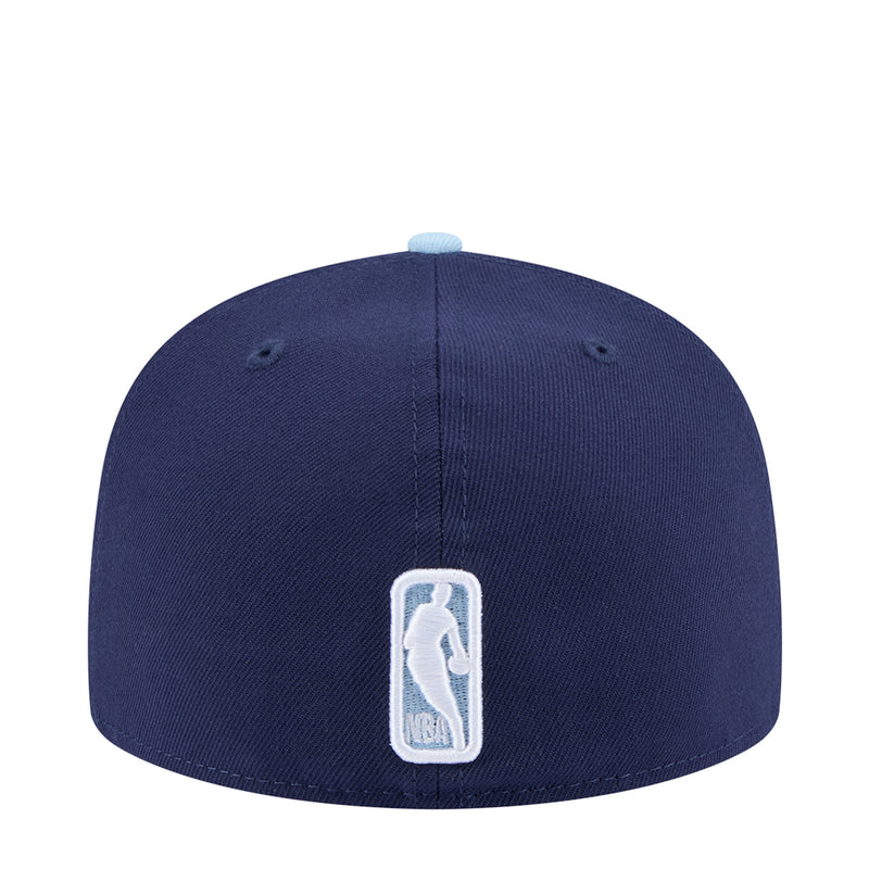 Two-tone baseball cap, dark navy crown with light brim and embroidered back logo