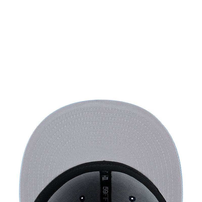 Two-tone baseball cap panel close-up with light silver fabric and black underside
