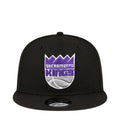 Black snapback baseball cap with Sacramento Kings front graphic and curved brim