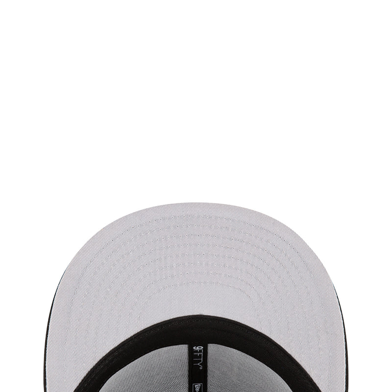 Light gray baseball cap crown close-up with black interior band