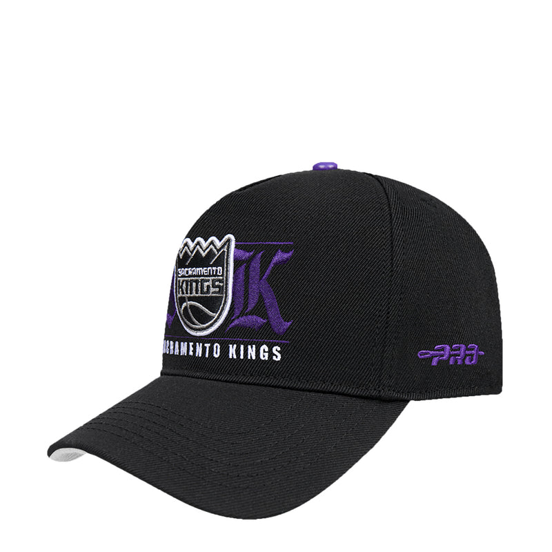 Black snapback cap with large front logo graphic, purple accents, and short brim