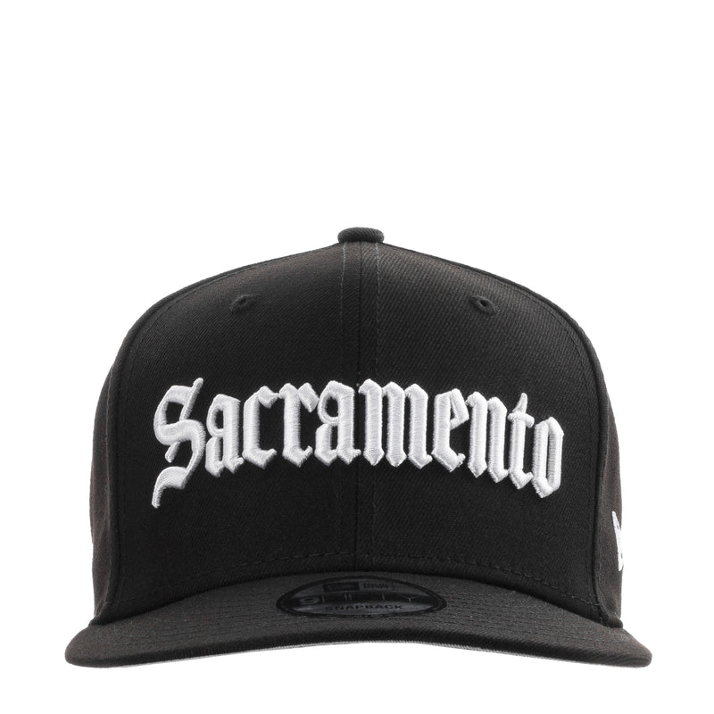 Black baseball cap with white Sacramento logo embroidery across front