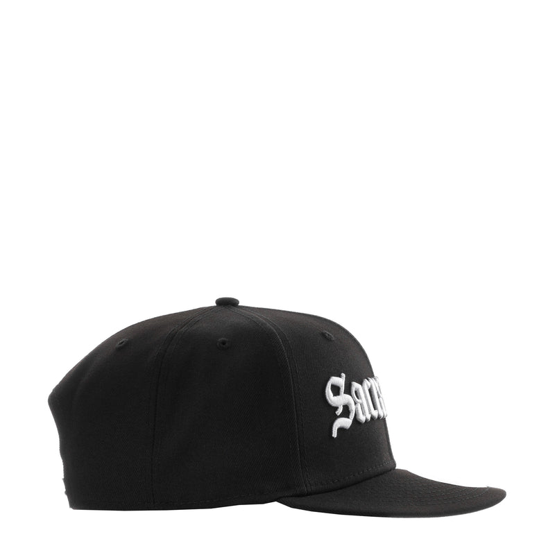 Black baseball cap with small white logo on side panel